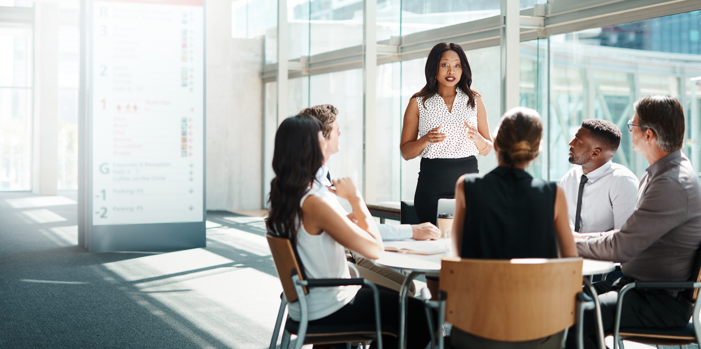 A group of people in a meeting