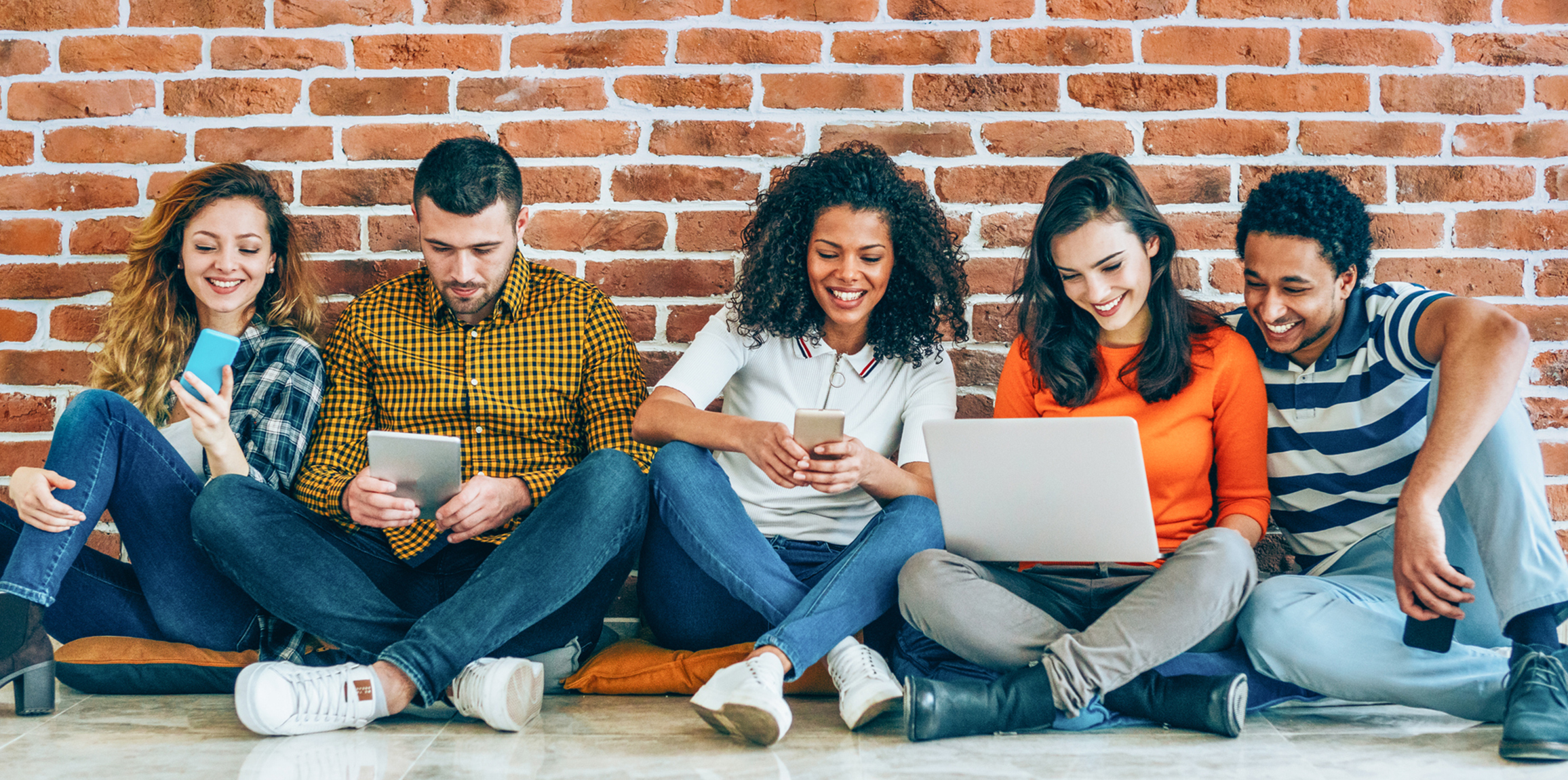 Group of young people using media devices